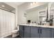 Elegant bathroom showcasing double sinks, a large mirror, and modern fixtures for a luxurious experience at 19595 W San Miguel Ave, Litchfield Park, AZ 85340