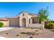 Charming single-story home with a desert landscaped front yard and neutral paint at 19595 W San Miguel Ave, Litchfield Park, AZ 85340