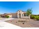 Charming single-story home with a desert landscaped front yard and neutral paint at 19595 W San Miguel Ave, Litchfield Park, AZ 85340