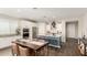 Well-lit kitchen with stainless steel appliances, a blue island, and bar stool seating at 19595 W San Miguel Ave, Litchfield Park, AZ 85340
