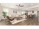 Living room with open access to a well-lit kitchen and dining area at 19595 W San Miguel Ave, Litchfield Park, AZ 85340