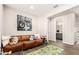 Relaxing living room with a motorcycle painting and modern furnishings offering an inviting atmosphere at 19595 W San Miguel Ave, Litchfield Park, AZ 85340