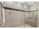 Shower with multiple shower heads and a built-in seat at 19595 W San Miguel Ave, Litchfield Park, AZ 85340