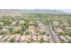 Aerial view highlights a neighborhood street, lined with trees and houses at 20699 W Ridge Rd, Buckeye, AZ 85396