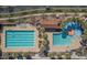 Aerial view of the pools, splash pad, and amenities in a well-designed community at 20699 W Ridge Rd, Buckeye, AZ 85396
