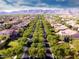 Expansive aerial view of the neighborhood featuring tree-lined streets and well-maintained homes at 20699 W Ridge Rd, Buckeye, AZ 85396