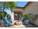 This relaxing backyard has comfortable outdoor seating around a fire pit under a covered patio at 20699 W Ridge Rd, Buckeye, AZ 85396
