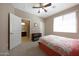 This is a comfortable bedroom leading to a bathroom; it features neutral walls and bright natural light at 20699 W Ridge Rd, Buckeye, AZ 85396
