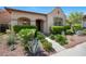 Attractive single-story house boasts a well-maintained landscape and inviting walkway at 20699 W Ridge Rd, Buckeye, AZ 85396