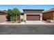 Detached two-car garage with a brown door and desert landscaping at 20699 W Ridge Rd, Buckeye, AZ 85396
