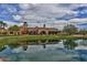 The clubhouse at Verrado golf course is seen with lake reflecting the building at 20699 W Ridge Rd, Buckeye, AZ 85396