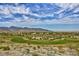 The Verrado golf course sits among desert landscape with mountain views at 20699 W Ridge Rd, Buckeye, AZ 85396