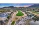 Stunning aerial view of a golf course with manicured greens, desert landscaping and upscale homes at 20699 W Ridge Rd, Buckeye, AZ 85396