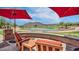 Beautiful view of the Verrado Golf Course with water feature, mountain views, and seating area at 20699 W Ridge Rd, Buckeye, AZ 85396