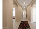 Inviting hallway with tiled flooring and views into the bedroom and living area at 20699 W Ridge Rd, Buckeye, AZ 85396