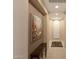 Well-lit hallway showcases neutral walls, tiled flooring, and a decorative rug at 20699 W Ridge Rd, Buckeye, AZ 85396