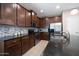 Well-equipped kitchen boasts granite countertops, stainless steel appliances, and ample cabinet space at 20699 W Ridge Rd, Buckeye, AZ 85396