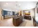 Open floor plan kitchen, dining and living area at 20699 W Ridge Rd, Buckeye, AZ 85396