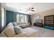 Comfortable living room with a large sofa, entertainment center, and stylish decor at 20699 W Ridge Rd, Buckeye, AZ 85396