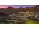 The Verrado golf course features a hillside view and mountain range at 20699 W Ridge Rd, Buckeye, AZ 85396