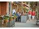 Outdoor restaurant seating features views of beautifully landscaped pedestrian walkways at 20699 W Ridge Rd, Buckeye, AZ 85396