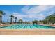 Large swimming pool with lane markers and plenty of lounge seating for residents at 20699 W Ridge Rd, Buckeye, AZ 85396