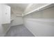Clean, empty walk-in closet features customizable shelving and ample hanging space for organized storage solutions at 20699 W Ridge Rd, Buckeye, AZ 85396