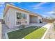 Desert backyard with artificial turf and low maintenance gravel at 22218 N 28Th St, Phoenix, AZ 85050