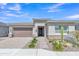 Beautiful single-story home with desert landscaping featuring cacti, stone accents, and neutral colors at 22218 N 28Th St, Phoenix, AZ 85050