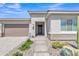 Inviting front entrance with desert landscaping, neutral colors, and stone accents at 22218 N 28Th St, Phoenix, AZ 85050