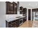 Gourmet kitchen boasting stainless steel appliances, custom cabinetry, and granite countertops at 22218 N 28Th St, Phoenix, AZ 85050