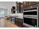 Well-equipped kitchen featuring stainless steel appliances, granite countertops, and custom cabinets at 22218 N 28Th St, Phoenix, AZ 85050