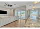 Open living space with natural light, wood floors, and a sliding glass door to the patio at 22218 N 28Th St, Phoenix, AZ 85050