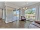 Bright living room with hardwood floors, modern lighting, and sliding glass doors to the patio at 22218 N 28Th St, Phoenix, AZ 85050