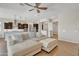 Bright living room and kitchen combo featuring hardwood floors, a ceiling fan, and an open design at 22218 N 28Th St, Phoenix, AZ 85050