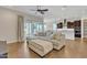 Spacious living room and kitchen combo featuring hardwood floors, and a sliding glass door to the outside at 22218 N 28Th St, Phoenix, AZ 85050