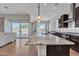 Open floorplan featuring an island kitchen, stainless appliances and view to outdoor living space at 22218 N 28Th St, Phoenix, AZ 85050