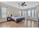 Spacious main bedroom with hardwood floors, ceiling fan, and large windows at 22218 N 28Th St, Phoenix, AZ 85050