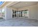 Covered patio with stone floors and glass doors to bring the outside in at 22218 N 28Th St, Phoenix, AZ 85050