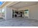 Outdoor patio overlooking an interior view of a modern kitchen and sliding glass doors at 22218 N 28Th St, Phoenix, AZ 85050