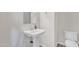 Cozy powder room with pedestal sink, neutral walls, and tiled floor at 22218 N 28Th St, Phoenix, AZ 85050