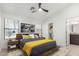 Staged bedroom with a ceiling fan, and modern decor; plenty of natural light enhances the appeal at 2250 E Deer Valley Rd # 96, Phoenix, AZ 85024