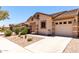 Exterior shot of home featuring desert landscaping, a tile roof, and an attached two-car garage at 2250 E Deer Valley Rd # 96, Phoenix, AZ 85024