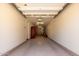 Empty two-car garage offering ample space and built-in storage at 2250 E Deer Valley Rd # 96, Phoenix, AZ 85024