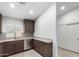 Kitchen featuring dark cabinetry, stone countertops, stainless appliances, and ample storage at 2250 E Deer Valley Rd # 96, Phoenix, AZ 85024