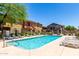Clean community pool, with surrounding lounge chairs and well-kept grounds at 2250 E Deer Valley Rd # 96, Phoenix, AZ 85024