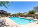 Community pool with lounge chairs and well maintained landscaping at 2250 E Deer Valley Rd # 96, Phoenix, AZ 85024