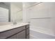 Bathroom with a tub and shower combo, and updated vanity with a quartz countertop at 25188 N 174Th Ave, Surprise, AZ 85387
