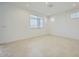 Bright bedroom with tile flooring, neutral walls, recessed lighting, and a large window at 25188 N 174Th Ave, Surprise, AZ 85387
