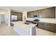 Modern kitchen with stainless steel appliances, a large center island, and plenty of cabinet space at 25188 N 174Th Ave, Surprise, AZ 85387